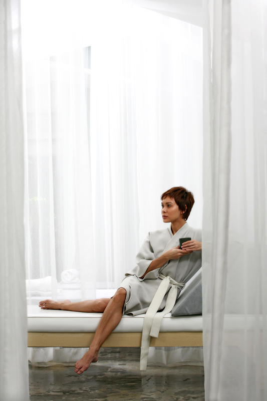 angel sitting down with tea in Ki bed