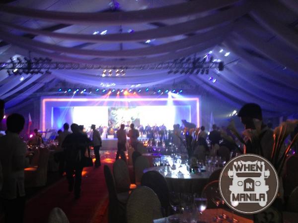 The Tent at the Manila Hotel is packed with prominent people and businessmen.
