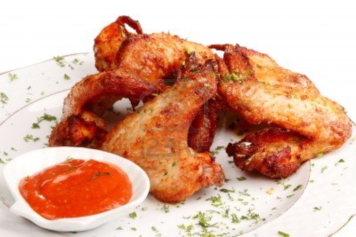 9296057-heap-fried-on-a-grill-of-chicken-wings-with-sauce-and-spices
