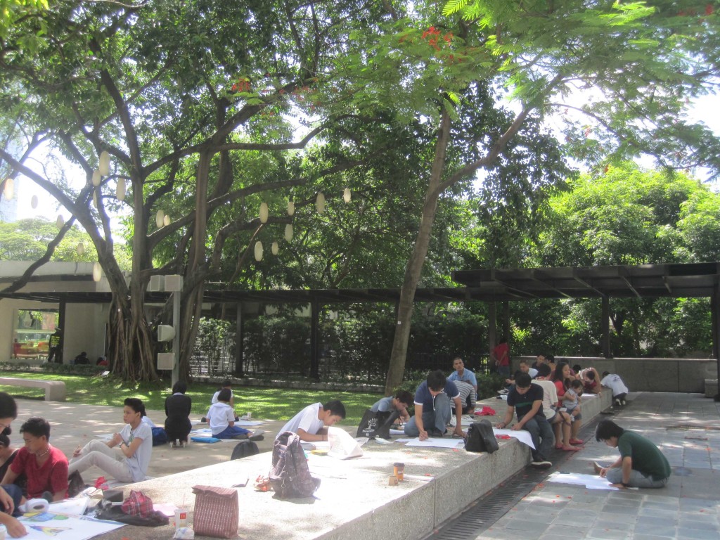 Participants sketching under the shade in Ayala Triangle Gardens
