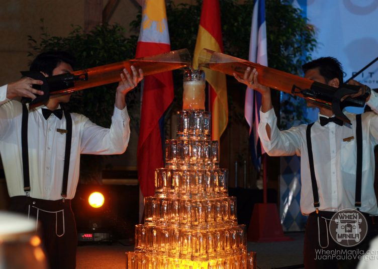 Oktoberfest Manila 2013 pouring of beer over tower of glass