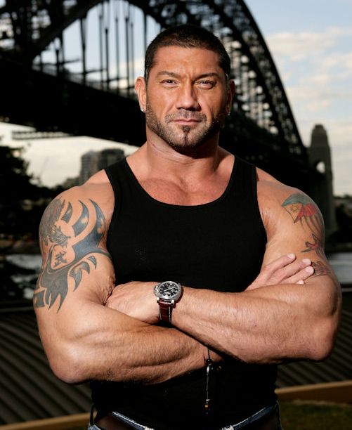 Dave Batista Showing His Tattoos