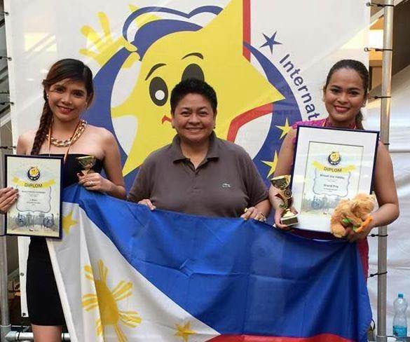Alyssa Hernandez (L) Charie Vega of Vega Entertainment and Head of Delegations - Philippines (C) and Krissel Valdez (R)
