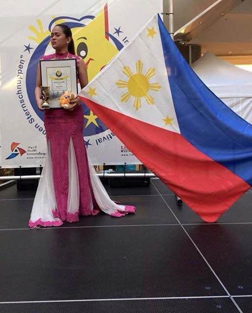 Krissel Valdez after receiving the Grand Prix award