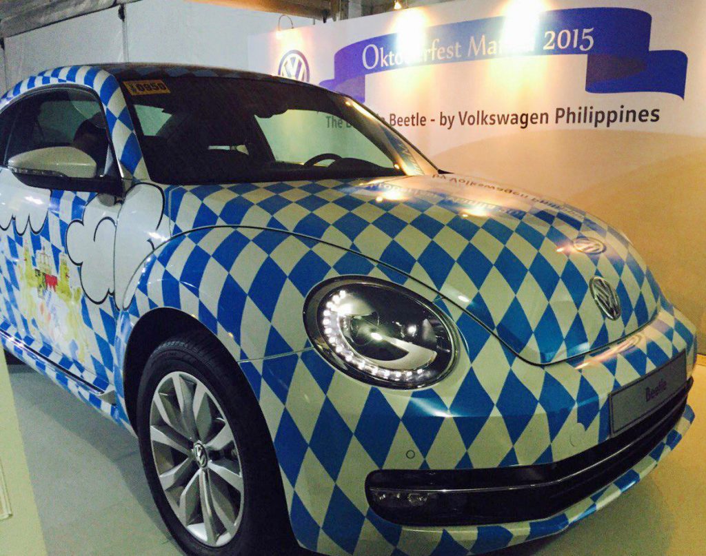 A beautiful Beetle in Bavarian colors at the entrance of Sofitel's 77th Oktoberfest.