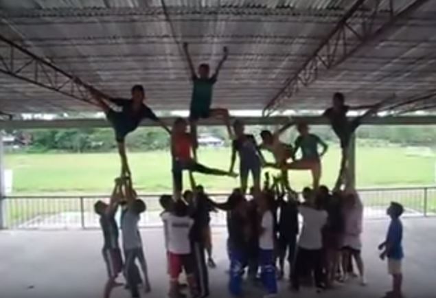 WATCH Cheerleader at the Top of Pyramid Gone Wrong Quickly Saves Herself