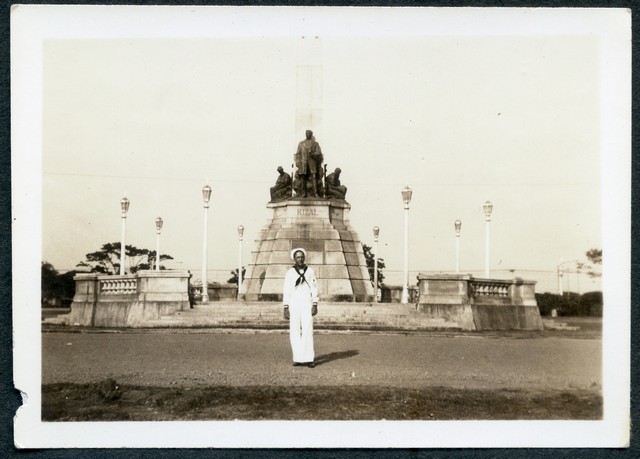 Rizal monument. T Rizal was a Spanard & due to his anti-Spanish movements liberated the islands from Spanish rule - therefore was shot for his trouble. The people named everything possible after him. Sort of a philippine god who died for the islands. That's me in front."