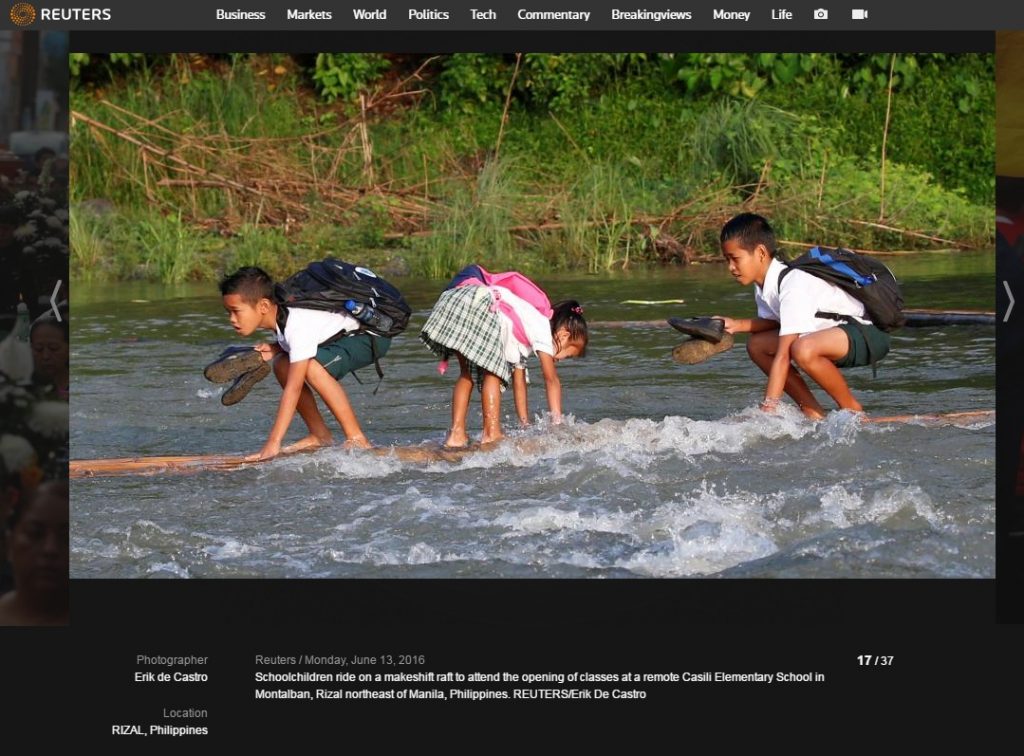 Children ride raft to school