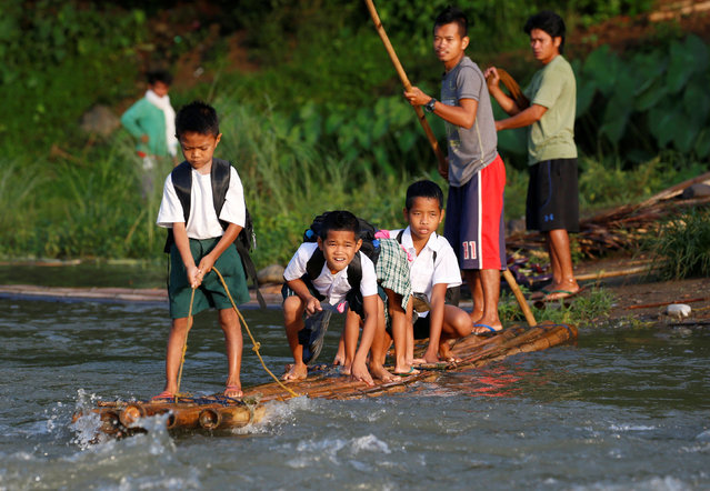 Children ride raft to school (2)