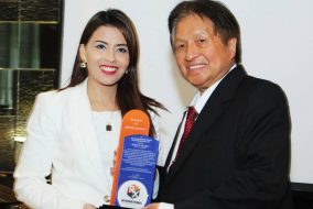RX International Events and Marketing Consultancy Company CEO Xiameer Valdeavilla presents a plaque of gratitude to her business partner and mentor Dr. Robert Sy.