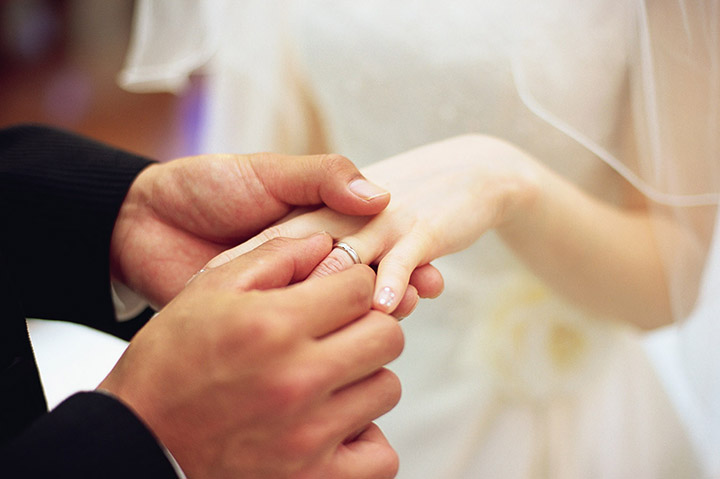 Pop the Question at Crowne Plaza Manila Galleria 1 Groom placing wedding ring on bride's finger