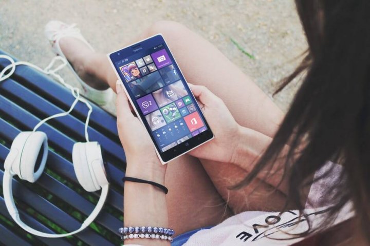 podcasts - Smartphone with ear phones