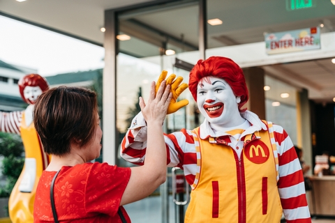 Chief Happiness Officer Ronald McDonald greeting customers at McDonalds Madison