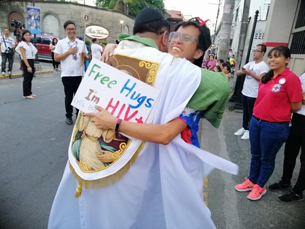 Priest Hugs HIV Positive HIV