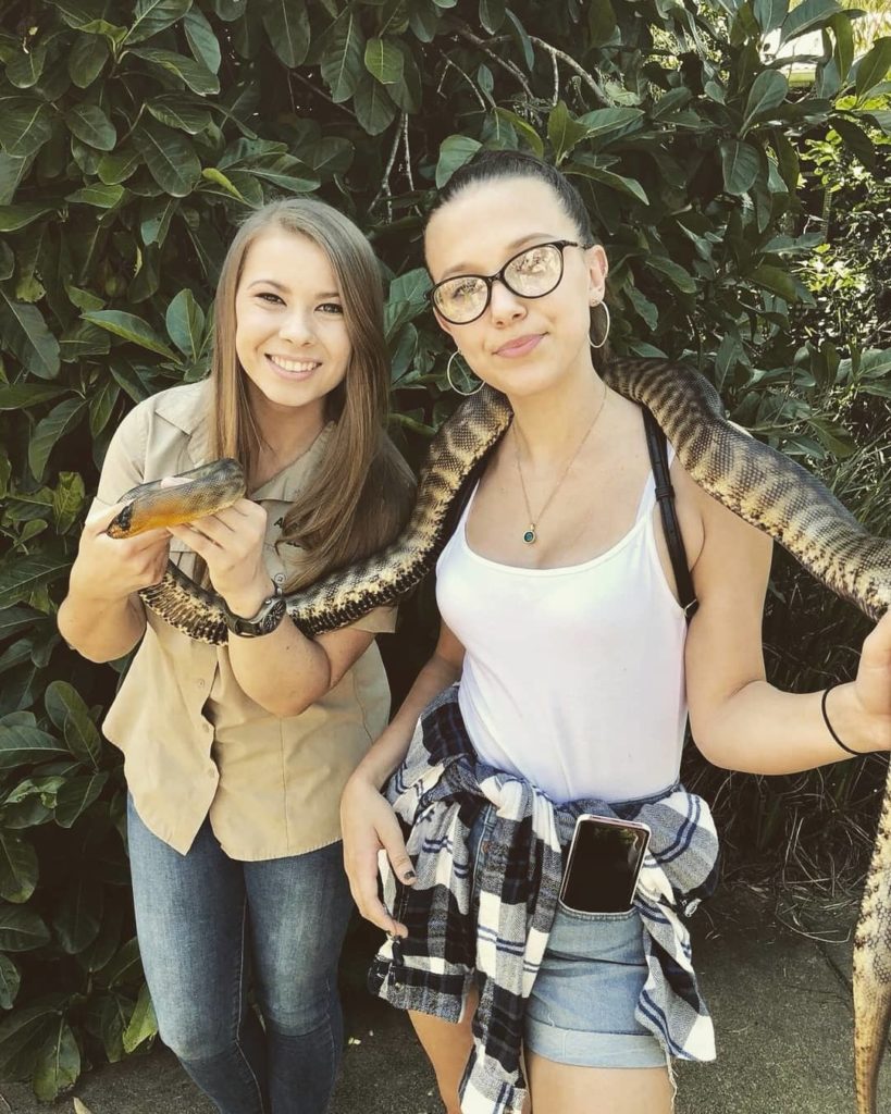 Millie Bobby Brown with a snake