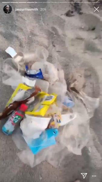 Jasmine and Jeff pick up beach trash