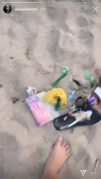 Jasmine and Jeff pick up beach trash