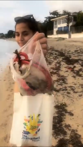 Jasmine and Jeff pick up beach trash