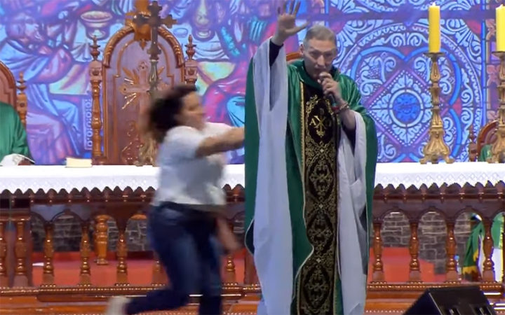 priest pushed off stage