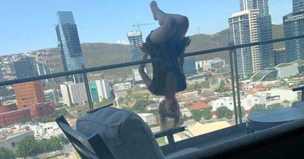 woman extreme yoga balcony fall header