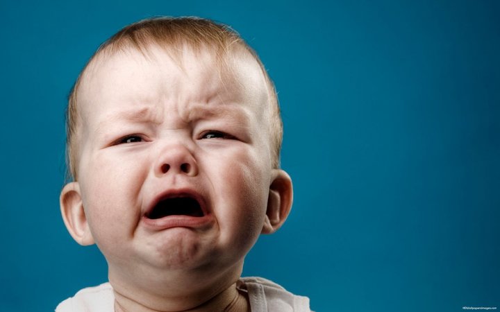 cute crying baby stock photo