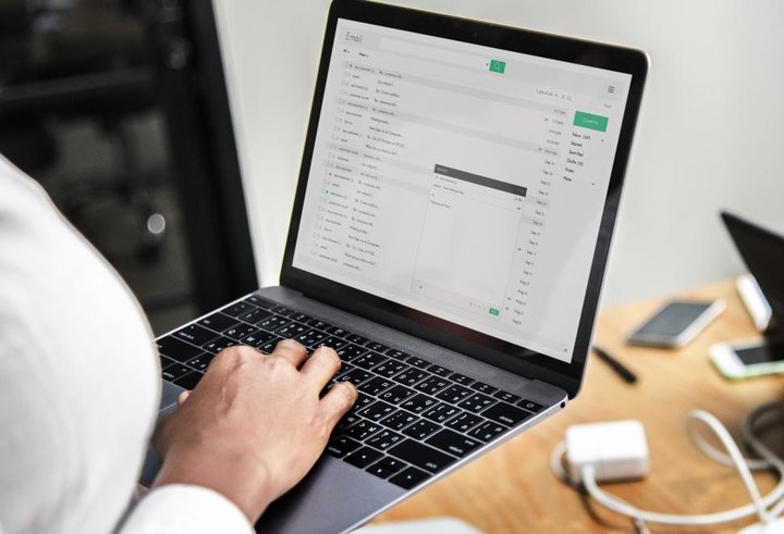 close up of a person sending email