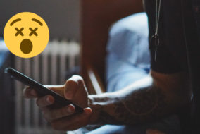 man phone bed night emoji