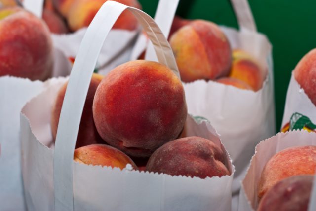 https://www.pexels.com/photo/pile-of-bags-of-peaches-2253534/