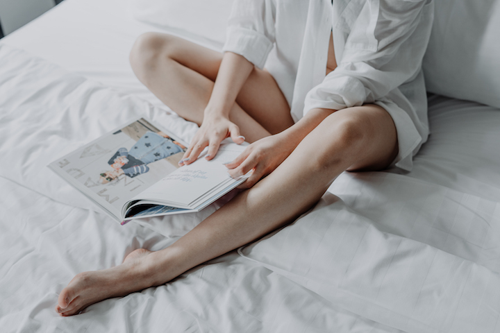 person reading in bed
