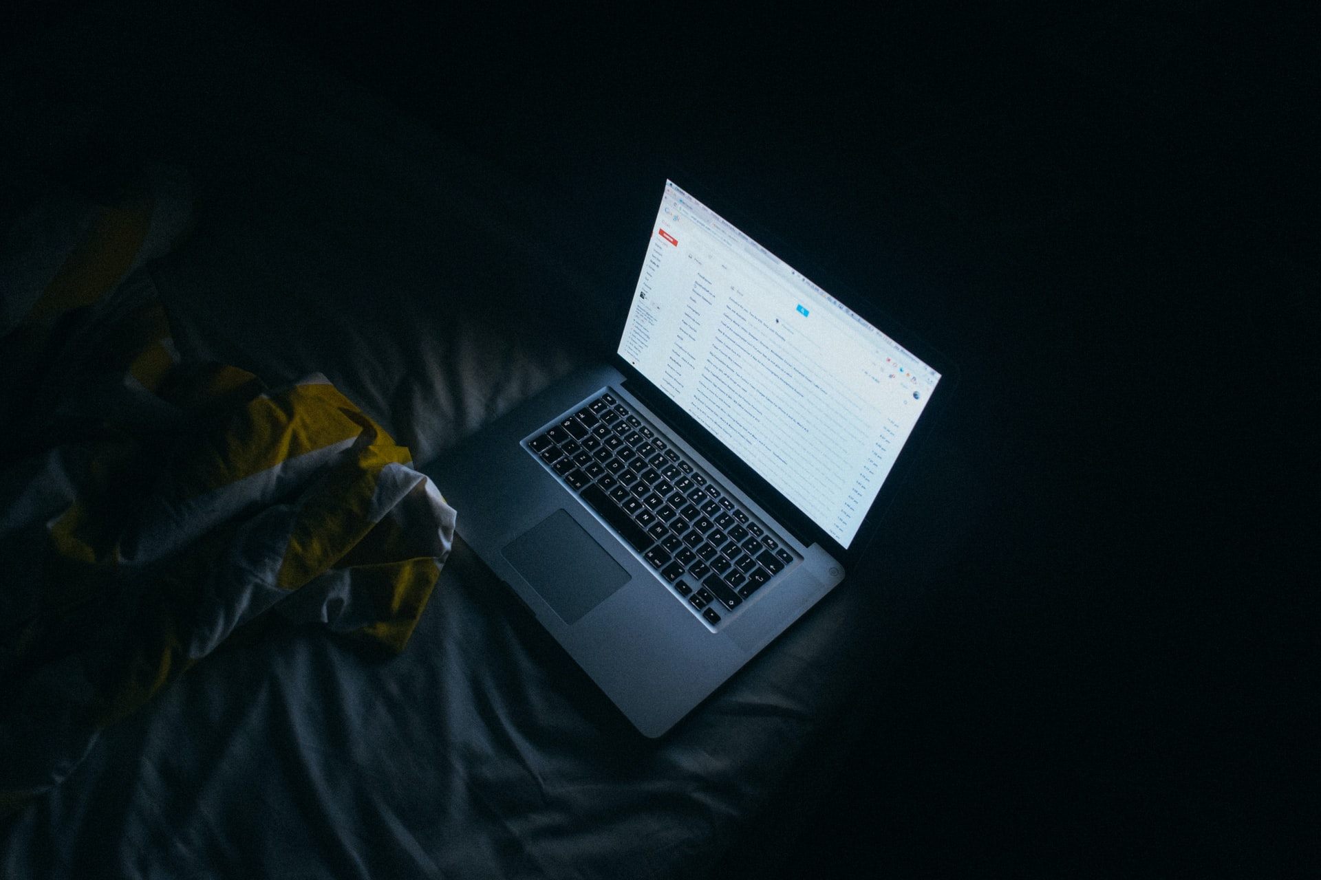 Laptop in bed at night