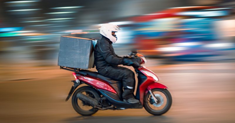 delivery rider stock motorcycle