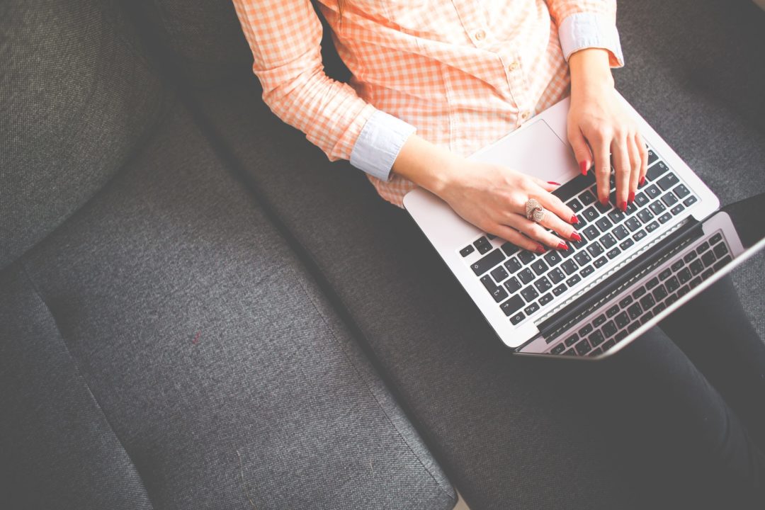 Woman Typing on Laptop scaled e1660367140149