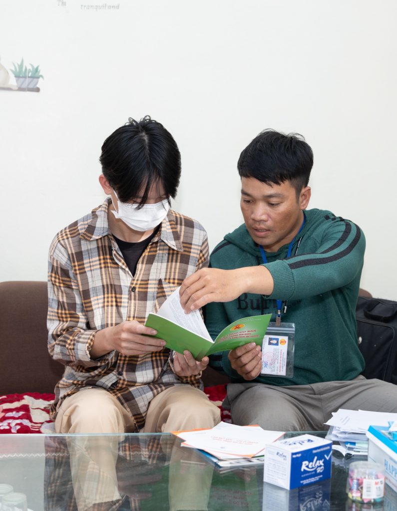 Community worker providing counseling on the use of condoms and lubricant in Viet Nam