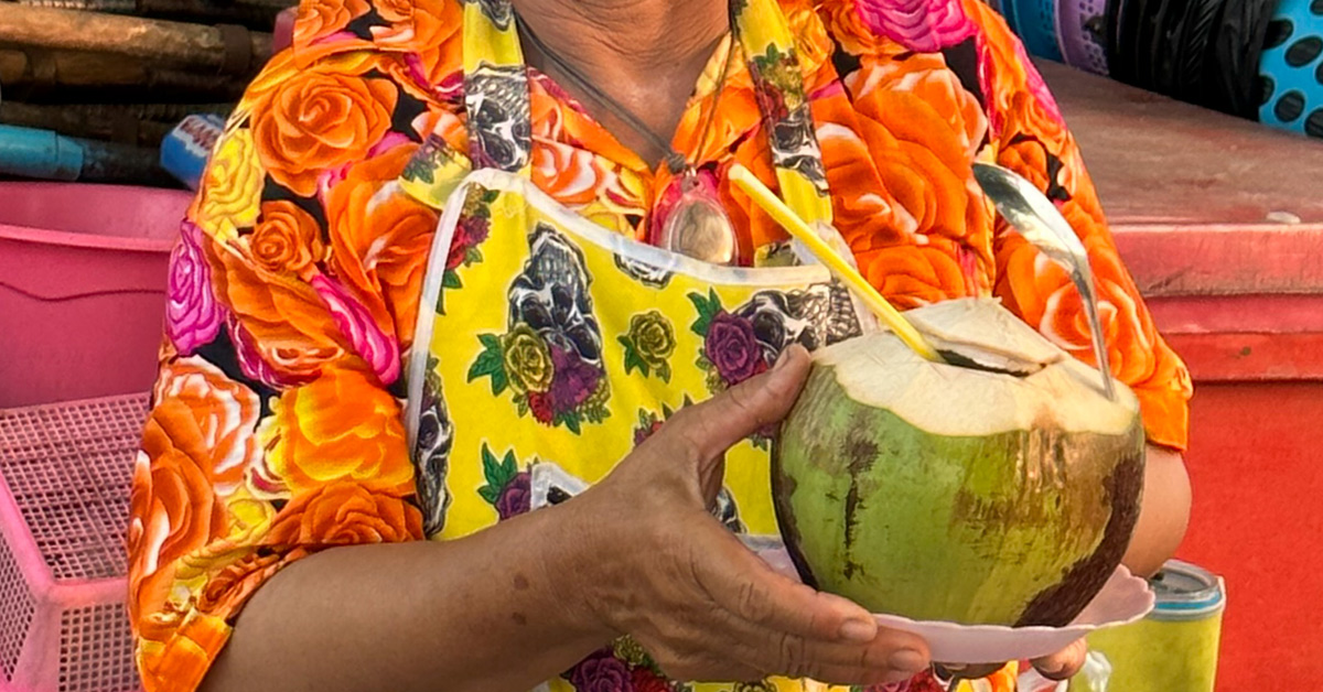 Have a refreshing coconut juice by the beach.