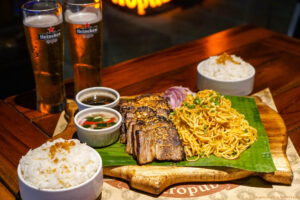 Tipsy Pig Pride Month Promo: Enjoy This Litson Baka With Garlic Noodles, Rice, and Beer for Two for Only P711