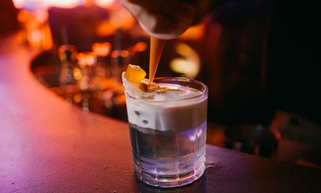 LOOK: These Cocktails are Perfect for the Holiday Season 3 The Merienda Colada is Sugarlandias holiday twist on the classic Pina Colada and the traditional Filipino snack turon and ube ice cream.