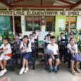 Labo Elementary School students with recycled chairs from traded in Samsonite luggage pieces 1