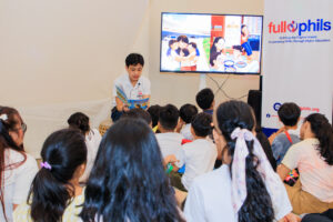 Emilio Baja, founder of Full Phils and author of “A Heart in Two Places,” during his book reading with the community children of Manila.