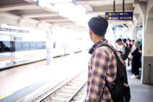 asian traveler man standing on railway platform wa 2025 09 08 08 20 32 utc
