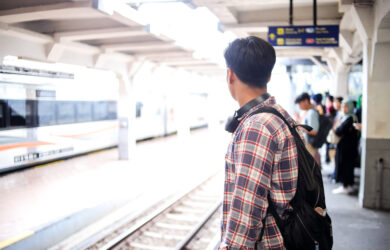 asian traveler man standing on railway platform wa 2025 09 08 08 20 32 utc