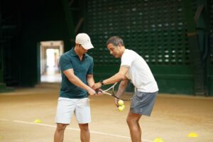 Home 6 Coach Roland Kraut at the Tennis Clinic